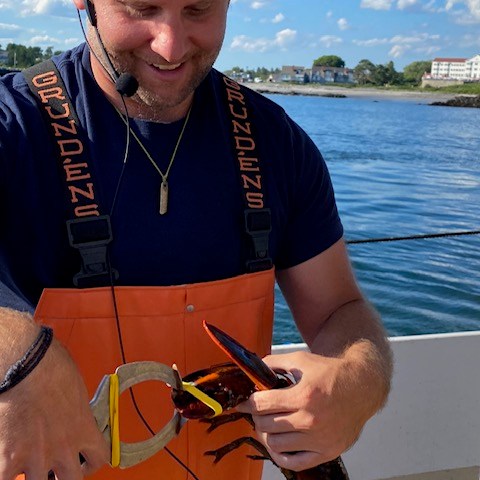 a man standing in front of a boat
